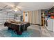 Garage with pool table, laundry hookups and storage cabinets at 1395 Emerald Dr, Kissimmee, FL 34744