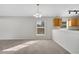 Bright dining room with chandelier and carpet at 613 Delaware Ave, Saint Cloud, FL 34769