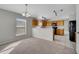 Dining area with chandelier and view of kitchen at 613 Delaware Ave, Saint Cloud, FL 34769