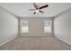 Spacious bedroom with neutral walls and carpeting at 613 Delaware Ave, Saint Cloud, FL 34769