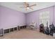 Charming bedroom with light purple walls and built-in storage at 6829 Sundrop St, Harmony, FL 34773