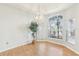 Bright dining area with large windows and a modern chandelier at 805 Via Bianca Dr, Davenport, FL 33896