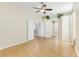Spacious bedroom with light laminate flooring and ceiling fan at 805 Via Bianca Dr, Davenport, FL 33896