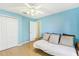Bedroom with light blue walls, daybed, and ceiling fan at 805 Via Bianca Dr, Davenport, FL 33896