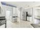 Bright kitchen featuring stainless steel appliances and ample cabinet space at 805 Via Bianca Dr, Davenport, FL 33896