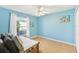 Light blue bedroom with wood floors and a daybed at 805 Via Bianca Dr, Davenport, FL 33896
