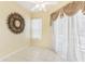 Bright dining area with tile floors and decorative mirror at 805 Via Bianca Dr, Davenport, FL 33896