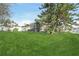 Large backyard with lush green grass and a screened pool at 805 Via Bianca Dr, Davenport, FL 33896