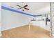 Light and airy living room with wood flooring and ceiling fan at 805 Via Bianca Dr, Davenport, FL 33896