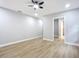 Bedroom with ceiling fan and access to bathroom at 135 S Chandler Ave, Deland, FL 32724