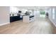 Open concept kitchen with island, blue cabinets, and white countertops at 135 S Chandler Ave, Deland, FL 32724