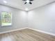 Grey walls, hardwood floors and a window with natural light at 135 S Chandler Ave, Deland, FL 32724