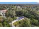 House nestled in a wooded area, aerial view at 135 S Chandler Ave, Deland, FL 32724