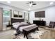 Main bedroom with large bed, dresser, and stylish decor at 135 S Chandler Ave, Deland, FL 32724