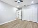 Light grey walls, hardwood floors, and a door to another room at 135 S Chandler Ave, Deland, FL 32724
