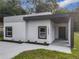 Modern house exterior with gray accents and a covered entryway at 135 S Chandler Ave, Deland, FL 32724