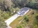 Aerial view of a house, showing its location and surrounding trees at 135 S Chandler Ave, Deland, FL 32724