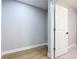 Small bedroom with hardwood floors and white door at 135 S Chandler Ave, Deland, FL 32724