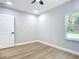 Bedroom with hardwood floors and a window at 135 S Chandler Ave, Deland, FL 32724