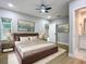 Primary bedroom with a plush bed and soft lighting at 135 S Chandler Ave, Deland, FL 32724