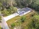 Aerial view of a modern house with a large backyard at 135 S Chandler Ave, Deland, FL 32724