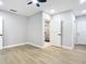 Bedroom with ceiling fan and access to bathroom at 135 S Chandler Ave, Deland, FL 32724