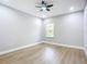 Spacious bedroom with hardwood floors and a large window at 135 S Chandler Ave, Deland, FL 32724