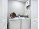 Convenient laundry room with washer, dryer, and storage at 135 S Chandler Ave, Deland, FL 32724