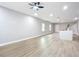 Bright living room featuring hardwood floors and an island kitchen at 135 S Chandler Ave, Deland, FL 32724