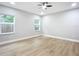 Bright bedroom with ceiling fan and hardwood floors at 135 S Chandler Ave, Deland, FL 32724