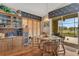 Bright dining area with wooden table and chairs, view to backyard at 507 Cortez Dr, Davenport, FL 33837