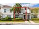 Two-story townhome with landscaping and parking at 8930 Stinger Dr, Davenport, FL 33896