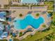 Freeform pool with surrounding lounge chairs at 2692 Meadowedge Loop, St Cloud, FL 34772