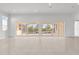 Open living space with large windows and pool access at 2692 Meadowedge Loop, St Cloud, FL 34772