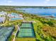 Community features tennis and pickleball courts and pools near lake at 2692 Meadowedge Loop, St Cloud, FL 34772