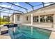 Resort-style pool and spa with a spacious patio at 2692 Meadowedge Loop, St Cloud, FL 34772