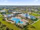 Community overview with pools, clubhouse, and tennis courts at 2692 Meadowedge Loop, Saint Cloud, FL 34772