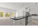 Large kitchen island with black countertop and stainless steel appliances at 2692 Meadowedge Loop, St Cloud, FL 34772