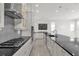 Modern kitchen with stainless steel appliances and gray backsplash at 2692 Meadowedge Loop, St Cloud, FL 34772