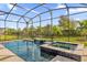 Relax in this luxurious pool and spa with a waterfall feature at 2692 Meadowedge Loop, St Cloud, FL 34772