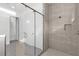 Large walk-in shower with neutral tile and glass enclosure at 2692 Meadowedge Loop, St Cloud, FL 34772