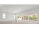 Bright living room with sliding glass doors leading to the pool at 2692 Meadowedge Loop, St Cloud, FL 34772