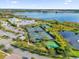 Community features tennis courts, pools, and a clubhouse near a lake at 2692 Meadowedge Loop, St Cloud, FL 34772