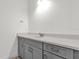 Modern bathroom with gray vanity and quartz countertop at 2692 Meadowedge Loop, St Cloud, FL 34772