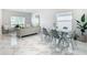 Bright dining area with glass table and gray chairs at 5031 Vellacito Way, Davenport, FL 33897