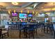 Bright and spacious community bar with seating and TVs at 8932 Stinger Dr, Davenport, FL 33896