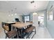 Kitchen and dining area with a farmhouse table and seating at 8932 Stinger Dr, Davenport, FL 33896