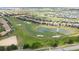 Aerial view of a luxury community with golf course and lake at 8932 Stinger Dr, Davenport, FL 33896