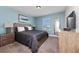 Charming bedroom with a queen-size bed and nightstands at 8932 Stinger Dr, Davenport, FL 33896