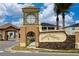 ChampionsGate community entrance with signage and landscaping at 8932 Stinger Dr, Davenport, FL 33896